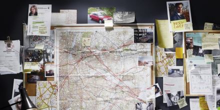 A rosary on a lace doily on a wooden table, adorned with sunflowers. Perfect for religious themes.